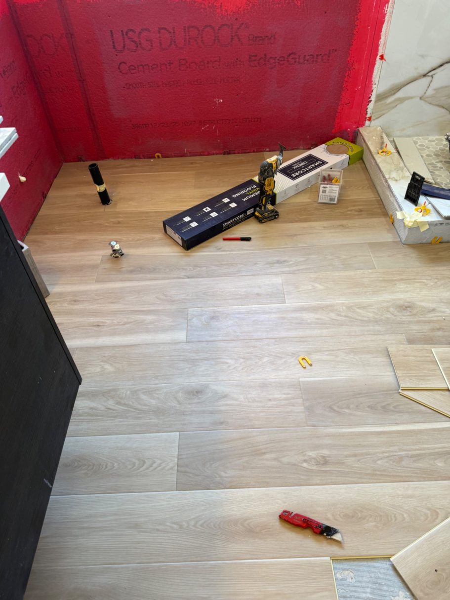 New flooring has began to be laid Complete Bathroom Remodel